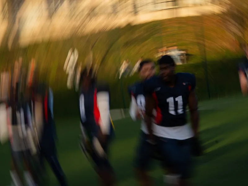 Players caught in a radial motion blur, the field pulled out around them