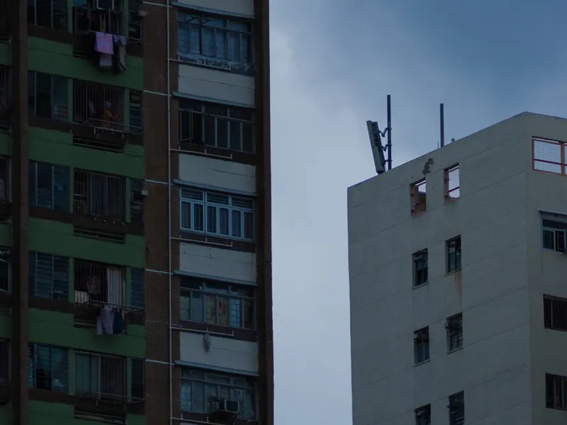 A tower block against a heavy grey sky